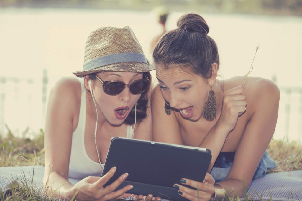 Two women viewing instagram stories
