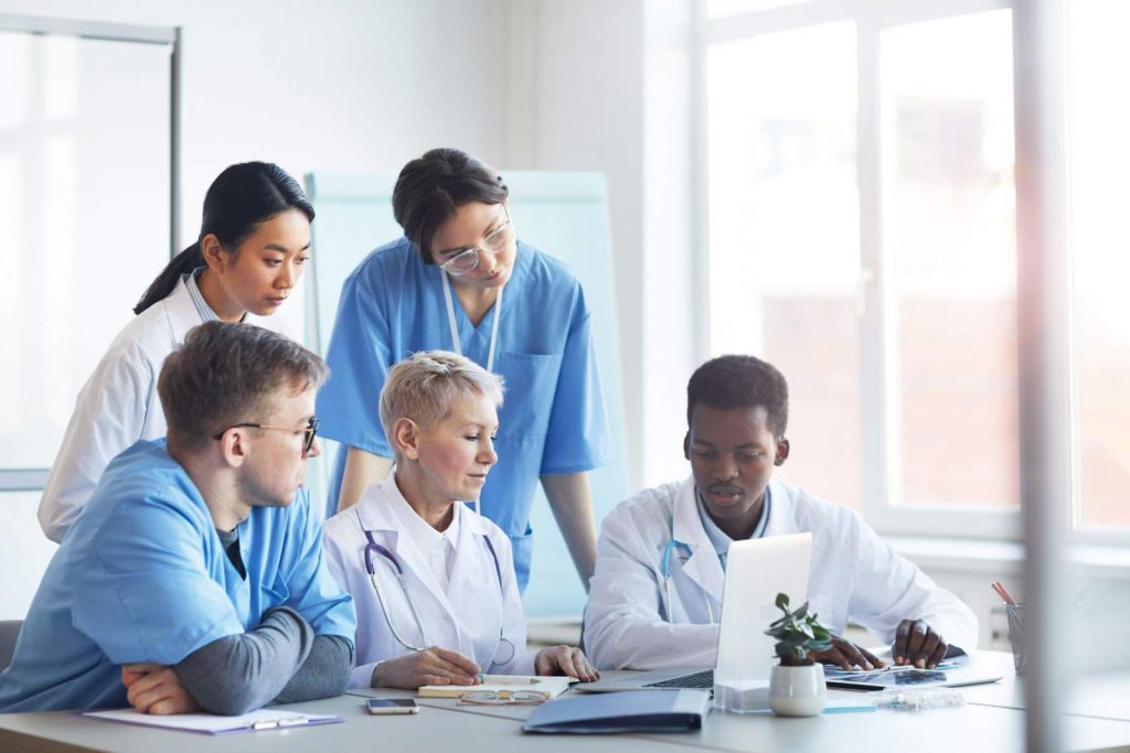 A group of medical professionals in a meeting