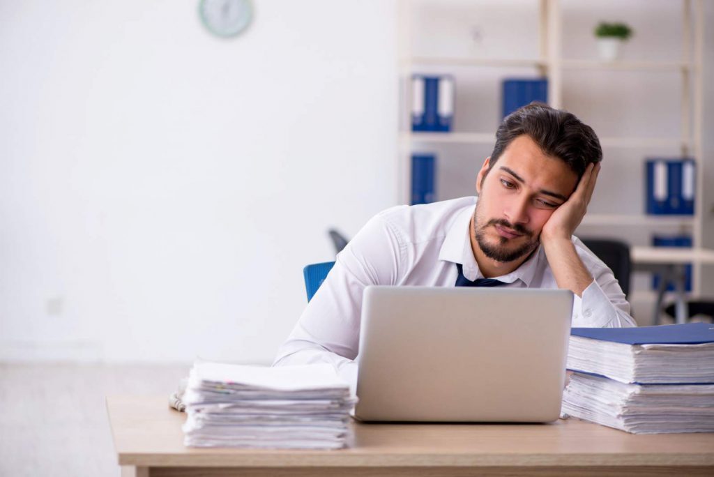 Healthcare professional opening a rejection email