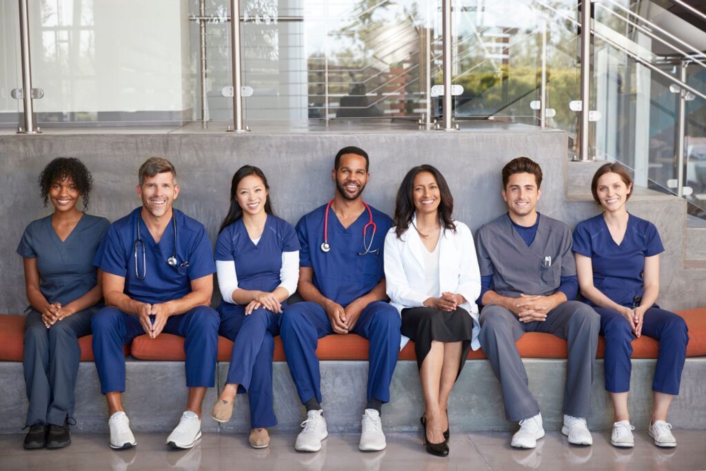 A group of healthcare workers smiling at the camera