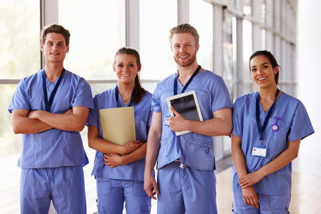 A group of healthcare workers smiling at the camera