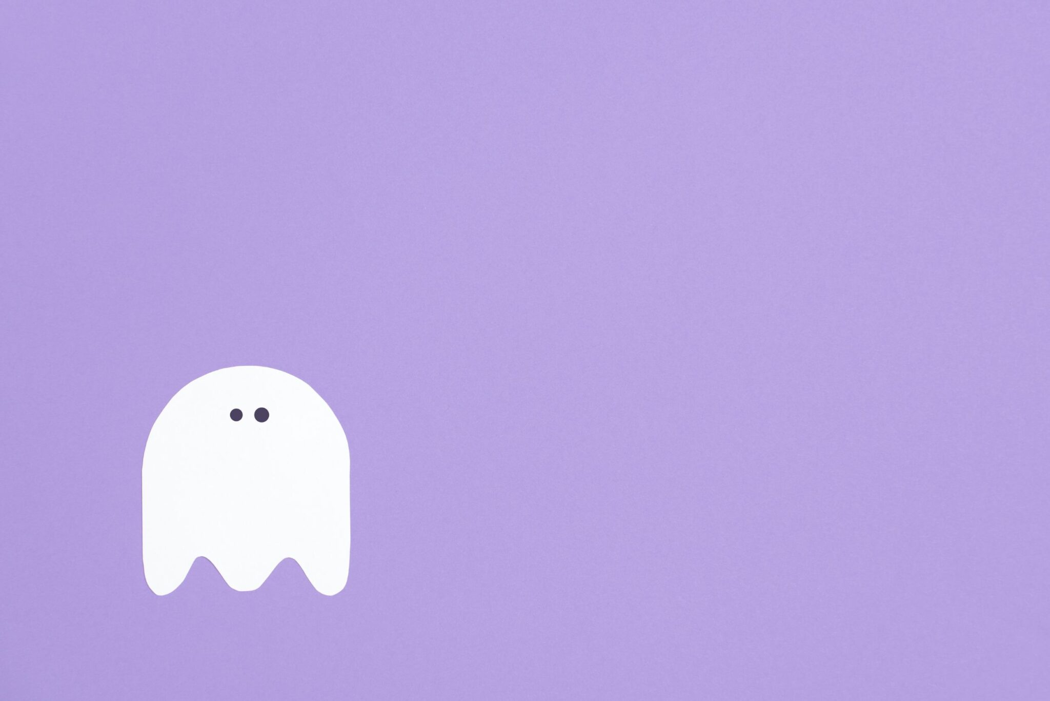 Cartoon ghost on purple background