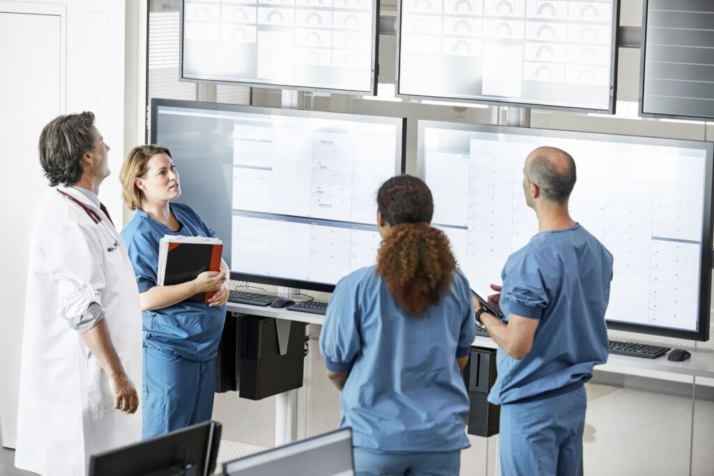A group of healthcare workers looking at a whiteboard