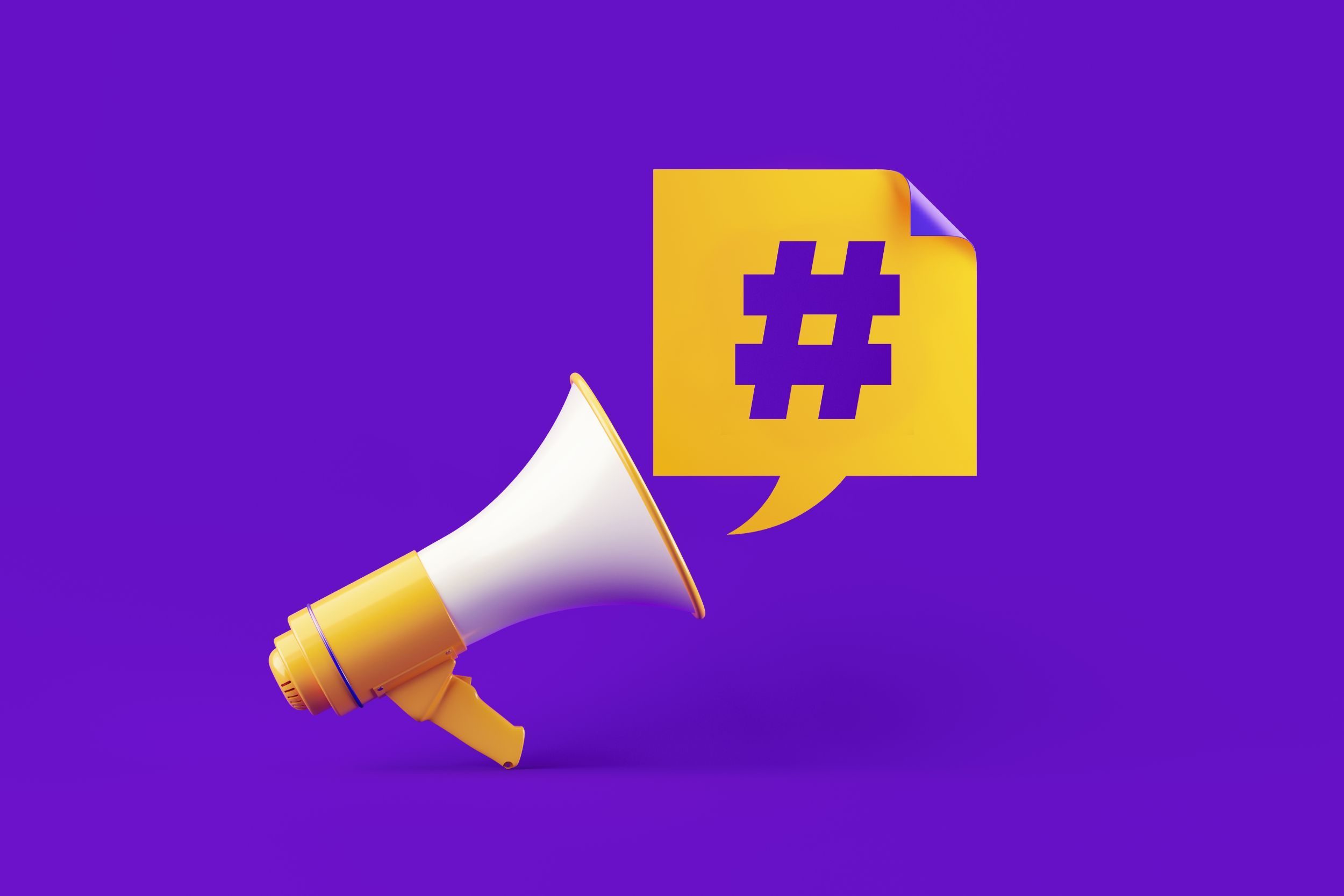 Megaphone pointed toward a hashtag on a yellow post-it-note
